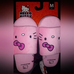 Hello kitty slippers. 1 pink 1 white pair.